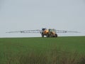 Farmer spraying chemicals in the fields