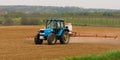 A farmer spraying with a Landini Evolution 9880 tractor.