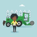 Farmer standing on the background of combine.