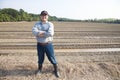 Farmer standing on farming land Royalty Free Stock Photo