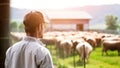 Farmer standing in front of herd of cows on the farm