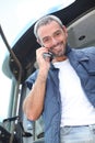 Farmer standing in his tractor Royalty Free Stock Photo