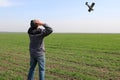 A farmer standing on his wheat field sees a small plane overhead about to crash Royalty Free Stock Photo