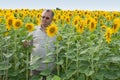 Farmer on a sun flower field Royalty Free Stock Photo