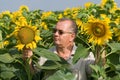 Farmer on a sun flower field Royalty Free Stock Photo