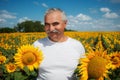 Farmer in sunflower field Royalty Free Stock Photo