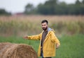 Farmer with rolled bale