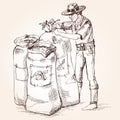 Farmer tie a bag of coffee beans.