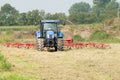 Farmer on a tractor is busy on the land