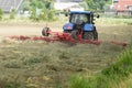 Farmer on a tractor is busy on the land