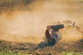 Farmer tractor with disc harrow system working on a stubble field Royalty Free Stock Photo