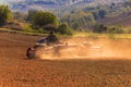 Farmer tractor with disc harrow system working on a stubble field Royalty Free Stock Photo