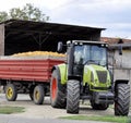 Farmer on tractor harvesting corn in autumn season Royalty Free Stock Photo