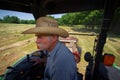 Farmer on Tractor Haying Field