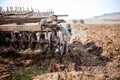 Farmer and tractor plowing in a field Royalty Free Stock Photo