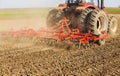 Farmer in tractor preparing land with seedbed cultivator Royalty Free Stock Photo