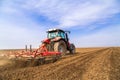 Farmer in tractor preparing land with seedbed cultivator. Royalty Free Stock Photo