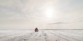 Farmer with tractor seeding - sowing crops at agricultural field Royalty Free Stock Photo