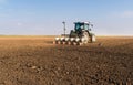 Farmer with tractor seeding - soy sowing crops at agricultural f Royalty Free Stock Photo