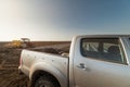 Farmer with tractor seeding - suv offroad vehicle on the field