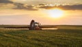 Farmer in tractor spraying crops Royalty Free Stock Photo