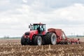 Farmer tractor working in the field. Spring time for sowing. Royalty Free Stock Photo