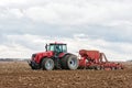 Farmer tractor working in the field. Spring time for sowing. Royalty Free Stock Photo