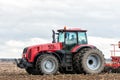 Farmer tractor working in the field. Spring time for sowing. Royalty Free Stock Photo