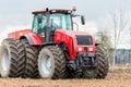 Farmer tractor working in the field. Spring time for sowing. Royalty Free Stock Photo