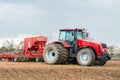 Farmer tractor working in the field. Spring time for sowing. Royalty Free Stock Photo