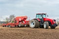 Farmer tractor working in the field. Spring time for sowing. Royalty Free Stock Photo