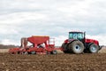 Farmer tractor working in the field. Spring time for sowing. Royalty Free Stock Photo