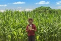 Farmer using digital tablet computer in cultivated corn field plantation Royalty Free Stock Photo