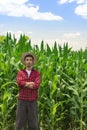 Farmer using digital tablet computer in cultivated corn field plantation Royalty Free Stock Photo