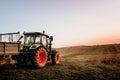 Farmer using modern tractor for harvesting Royalty Free Stock Photo