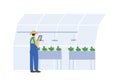 Farmer Using Tablet App in Greenhouse for IoT Smart Farmin Royalty Free Stock Photo