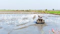 Farmer are using tractors to plow the fields