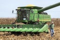 St. Mary`s, Missouri, USA, September 15, 2020 - Farmer walking from harvester combine in farm corn field