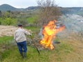 Farmer watching over a fire