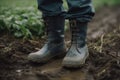 Farmer wearing rubber boots standing in wheatgrass field created by generative AI Royalty Free Stock Photo