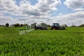 Farmer wheat field spraying herbicides Royalty Free Stock Photo