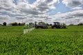 Farmer wheat field spraying herbicides