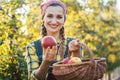 Farmer woman in fruit orchard holding apple in her hands Royalty Free Stock Photo