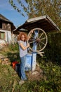 Farmer woman getting water from a well Royalty Free Stock Photo