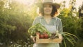 Farmer woman holding vegetable crate Royalty Free Stock Photo