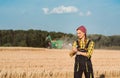 Farmer woman monitoring business progress of the harvest