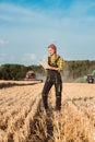 Farmer woman monitoring business progress of the harvest