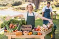 Farmer woman presenting a table of local food