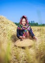 Farmer woman threshed rice in field Royalty Free Stock Photo