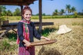 Farmer woman threshed rice in field Royalty Free Stock Photo